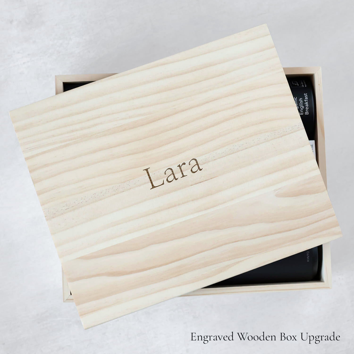 Wooden box with 'Lara' engraved on it, on a light gray background as an example of an engraved gift box.