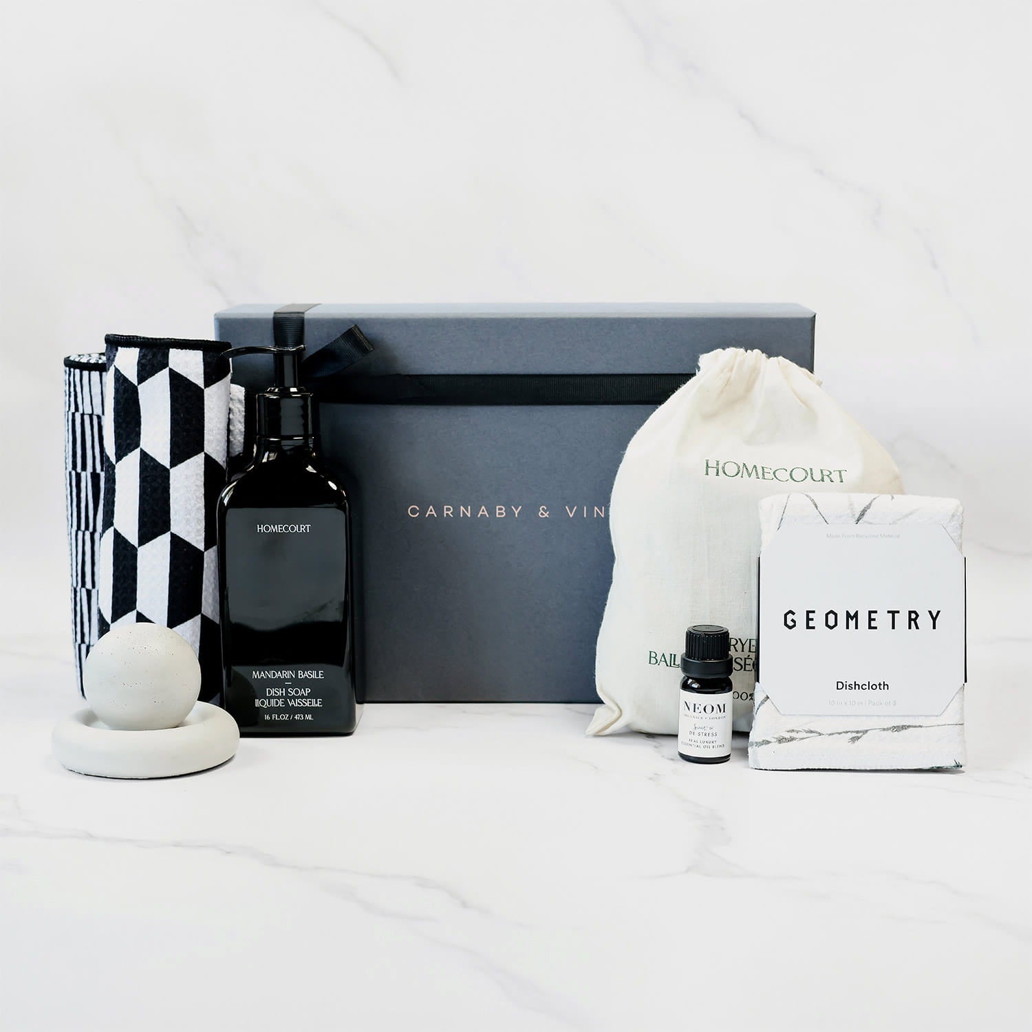 Gift set containing eco-conscious home cleaning tools and safe home care supplies.